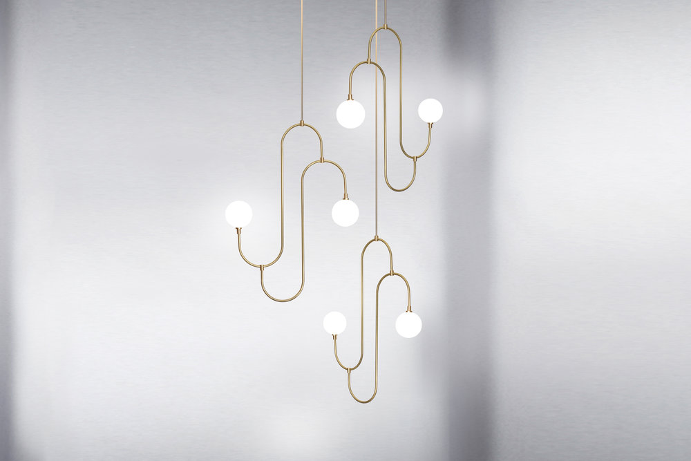 A chandelier by Marc Wood Studio called Jack and Jill. Inspired by repetitive patterns and sculptures of jewelry design in the 1930s.